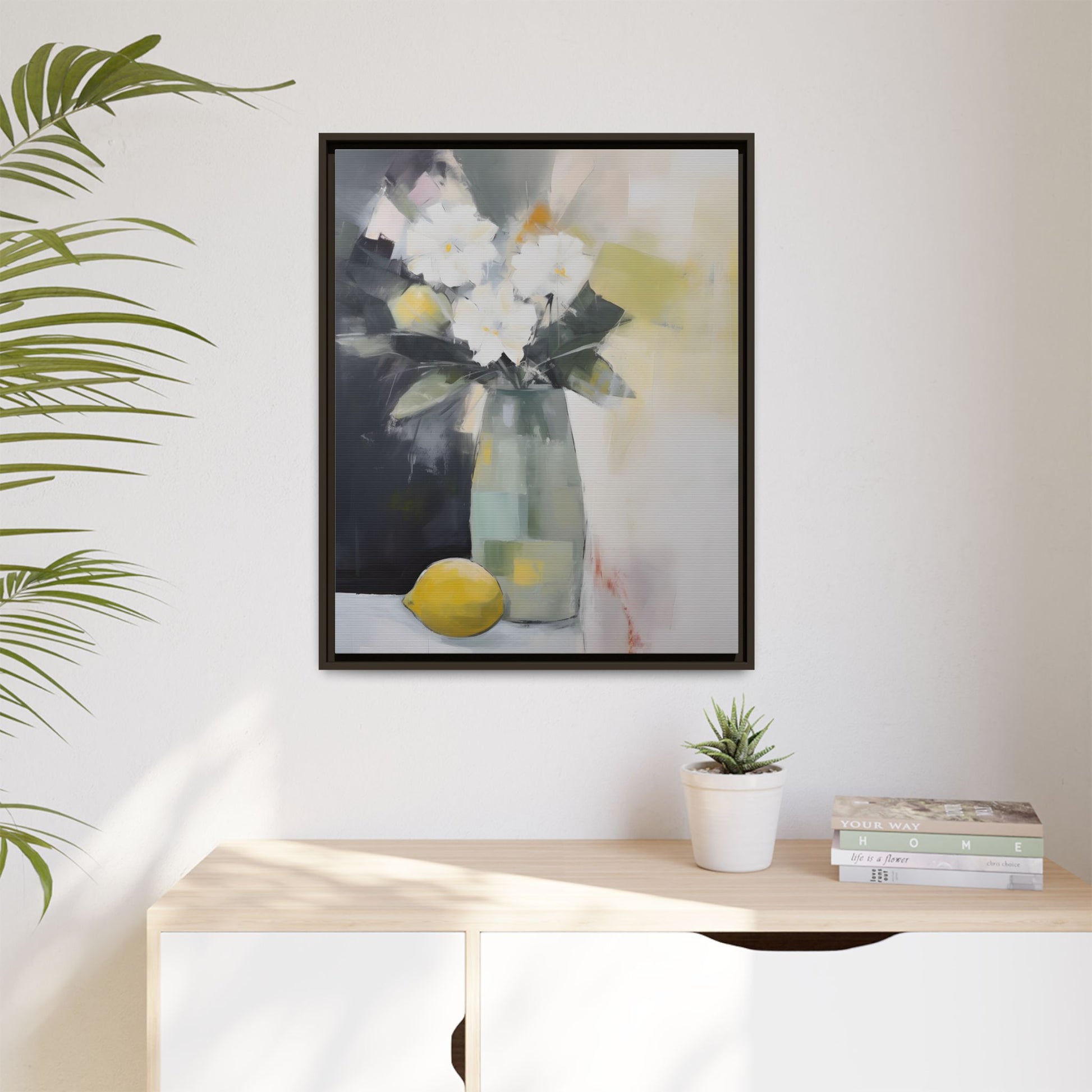 Modern Floral Still Life Wall Art – Framed Canvas with White Flowers and Lemon in Soft Green Vase on living room wall