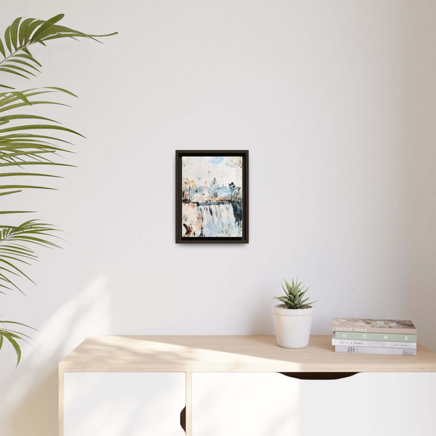Framed watercolor wall art of serene landscape, 12x9 inches, on a minimalist shelf with plants and books for home decor.