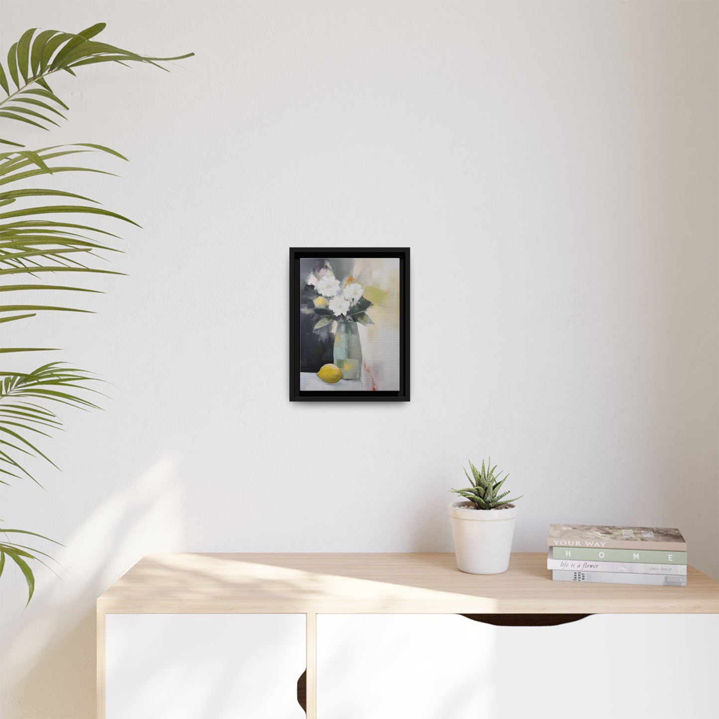 Modern Floral Still Life Wall Art – Framed Canvas with White Flowers and Lemon in Soft Green Vase, perfect for home decor.