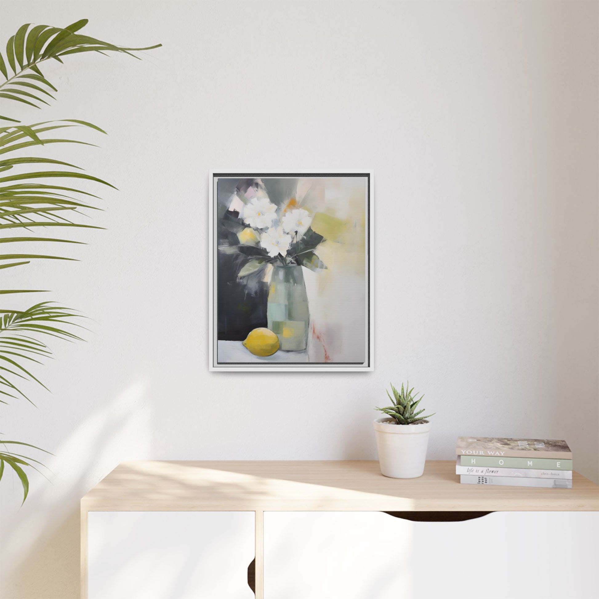 Modern Floral Still Life Wall Art – Framed Canvas with White Flowers and Lemon in Soft Green Vase on a minimalist wall