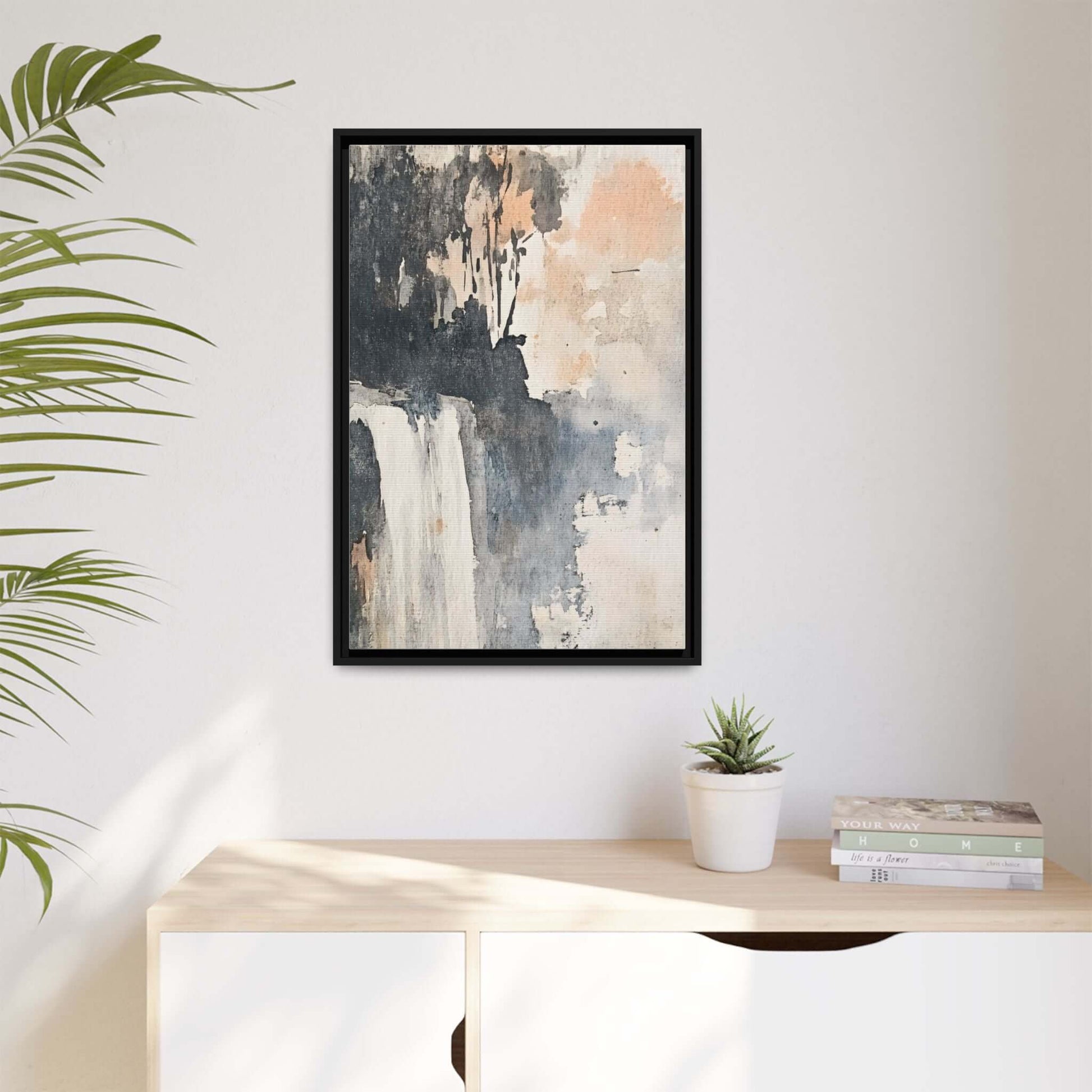 Framed waterfall art print on matte canvas, 9x12 inches, displayed in modern home decor setting with plant and books.