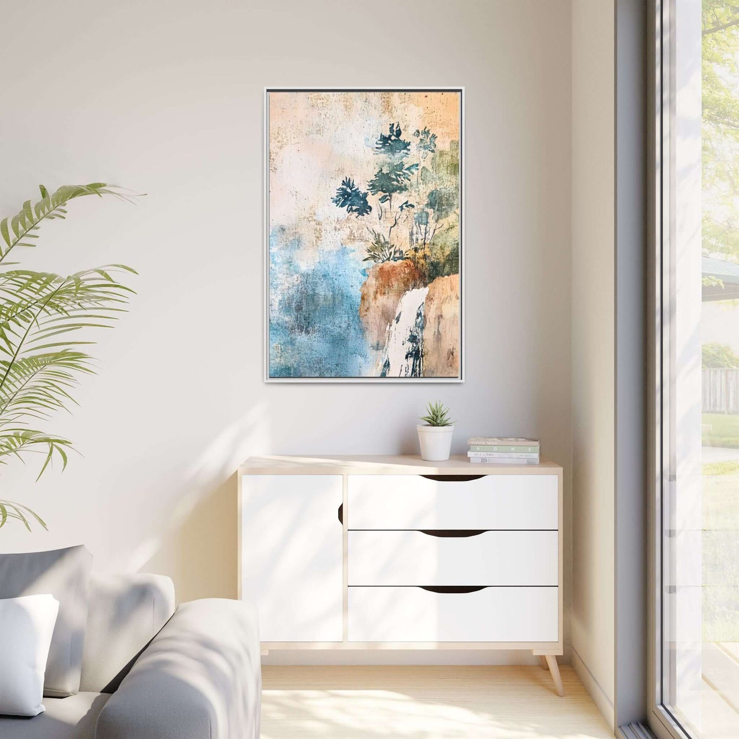 Framed watercolor canvas print of a misty forest landscape hanging in a bright, minimalistic living room.