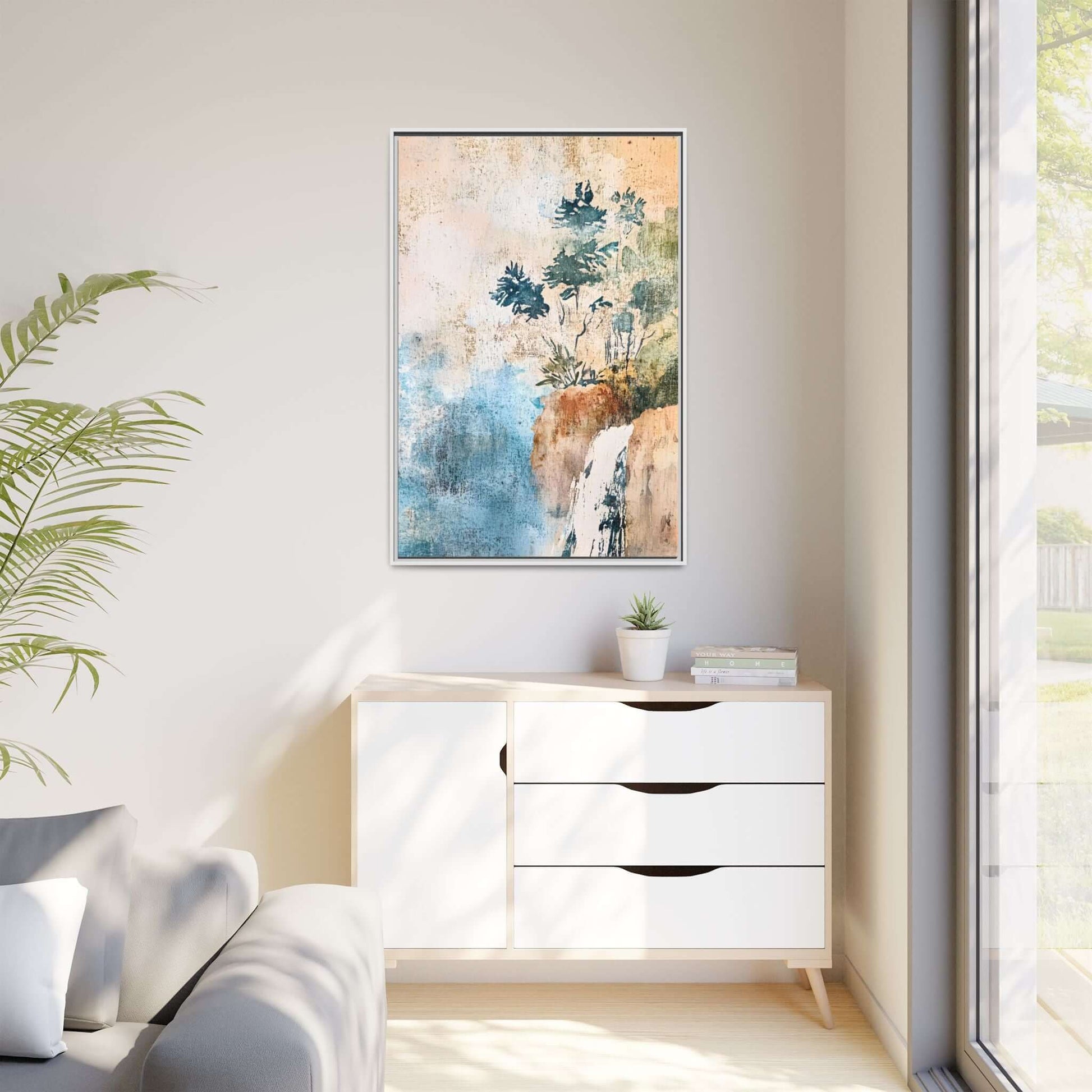 Framed watercolor canvas print of a misty forest landscape hanging in a bright, minimalistic living room.