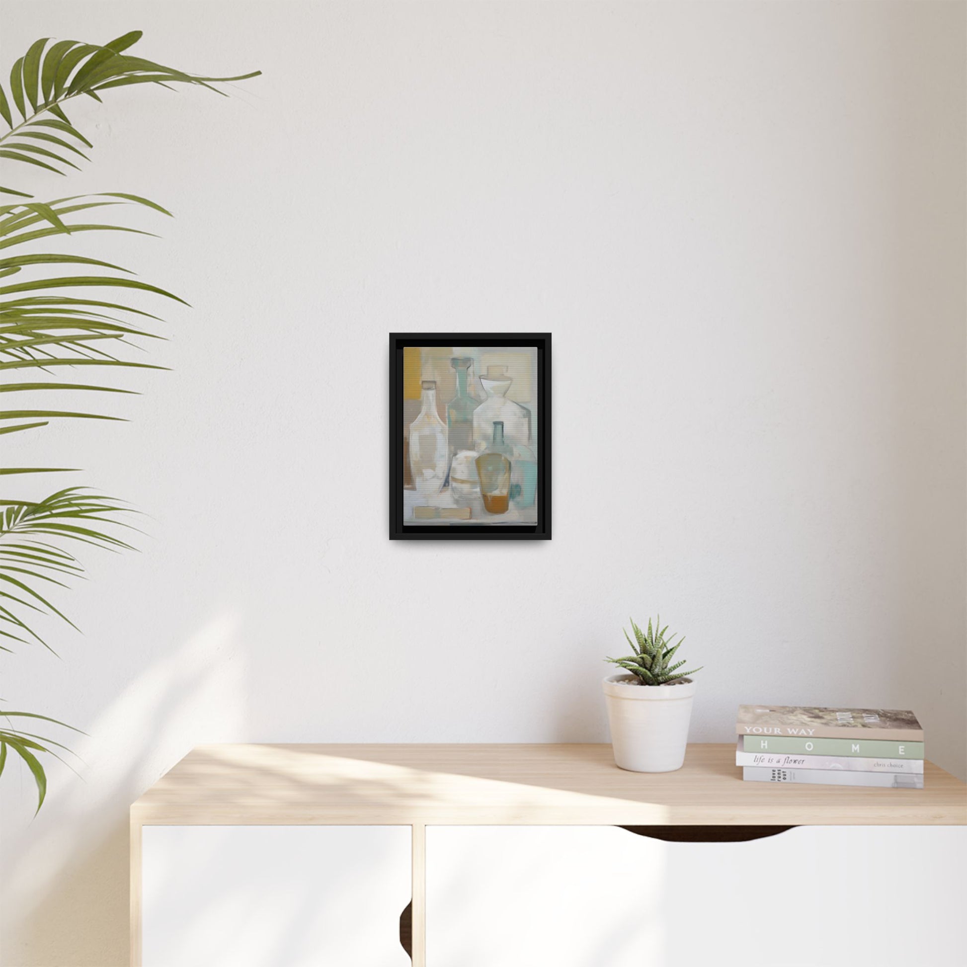 Modern Still Life Wall Art – Neutral Bottles Framed Canvas in Beige, Aqua & Amber hanging on a minimalist white wall above a console.