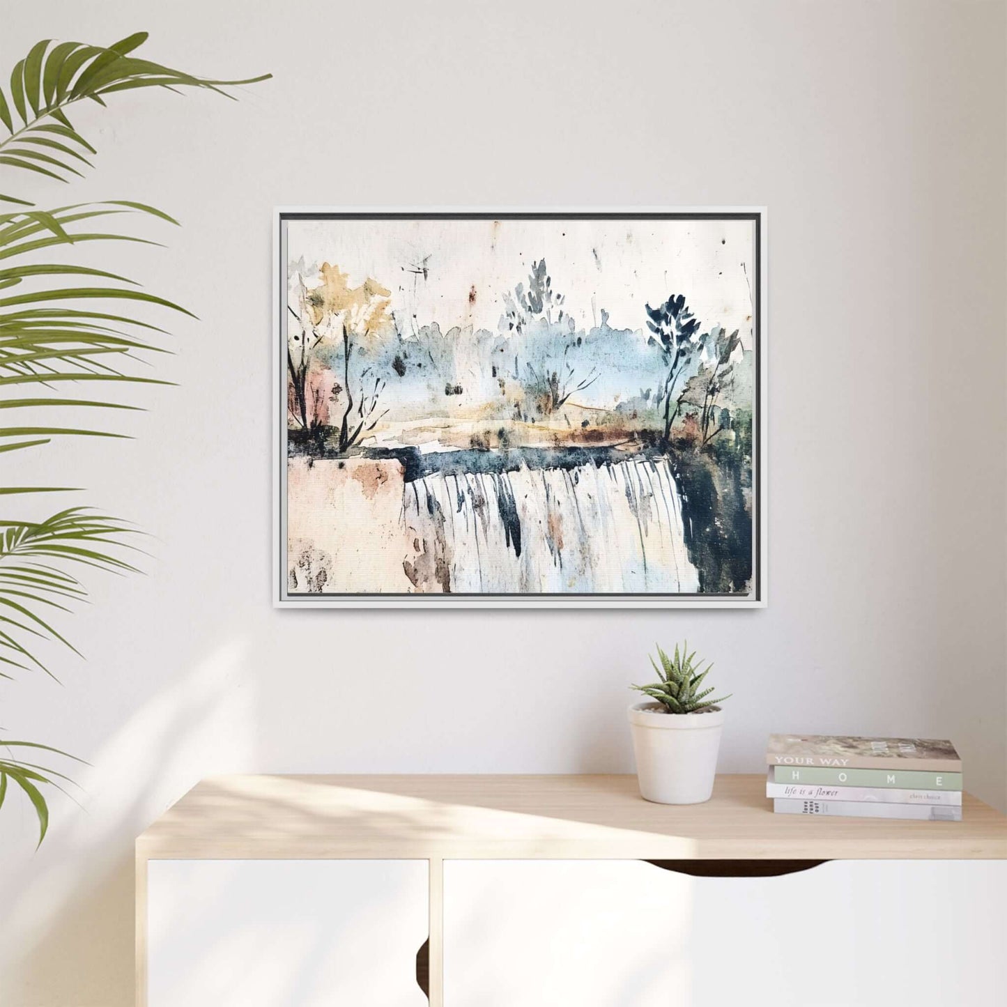 Framed watercolor wall art depicting a serene landscape with trees and a waterfall, perfect for home decor.