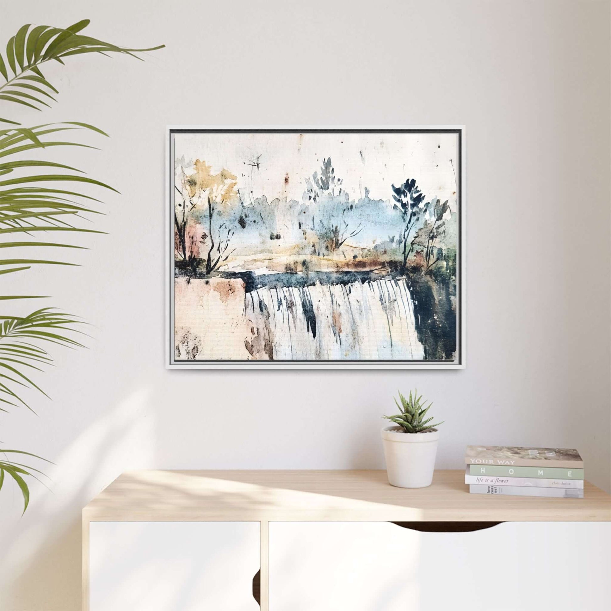 Framed watercolor wall art depicting a serene landscape with trees and a waterfall, perfect for home decor.