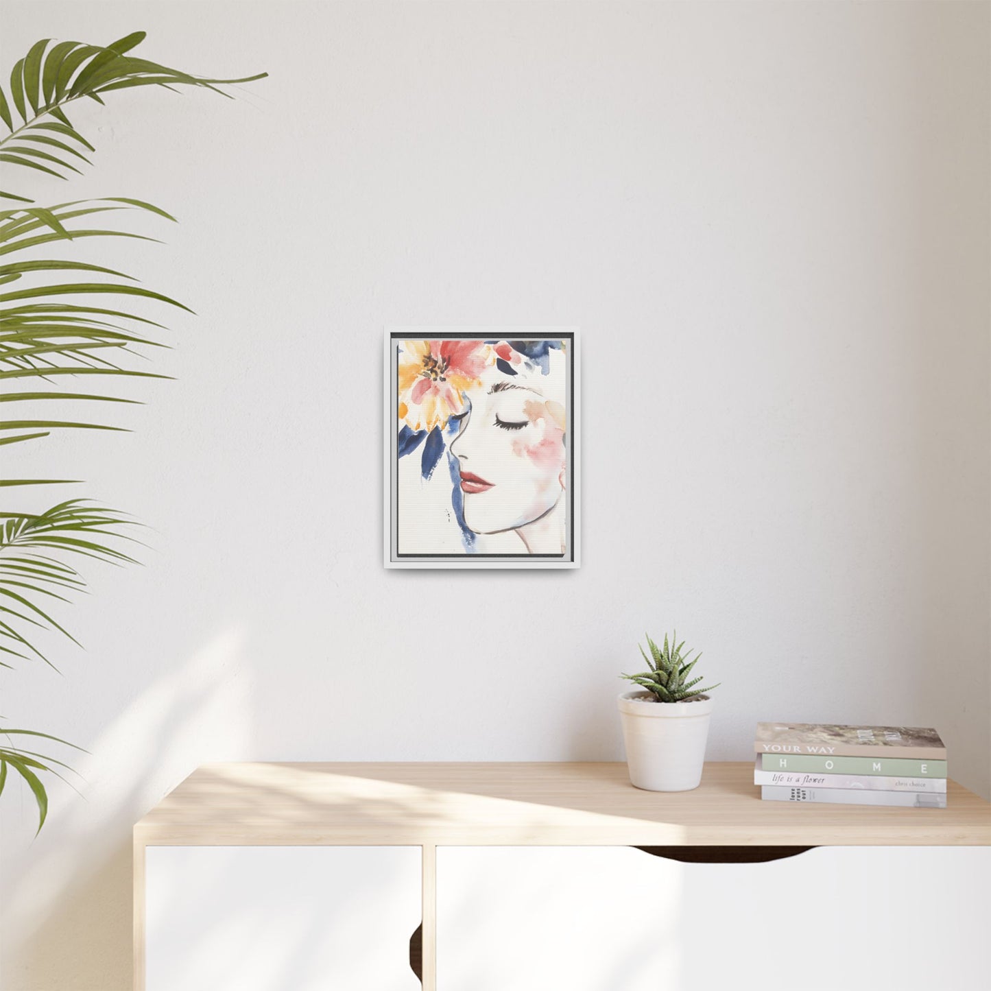 Multi-Color Framed Matte Canvas Art - Floral Face Portrait on wall with plant and books