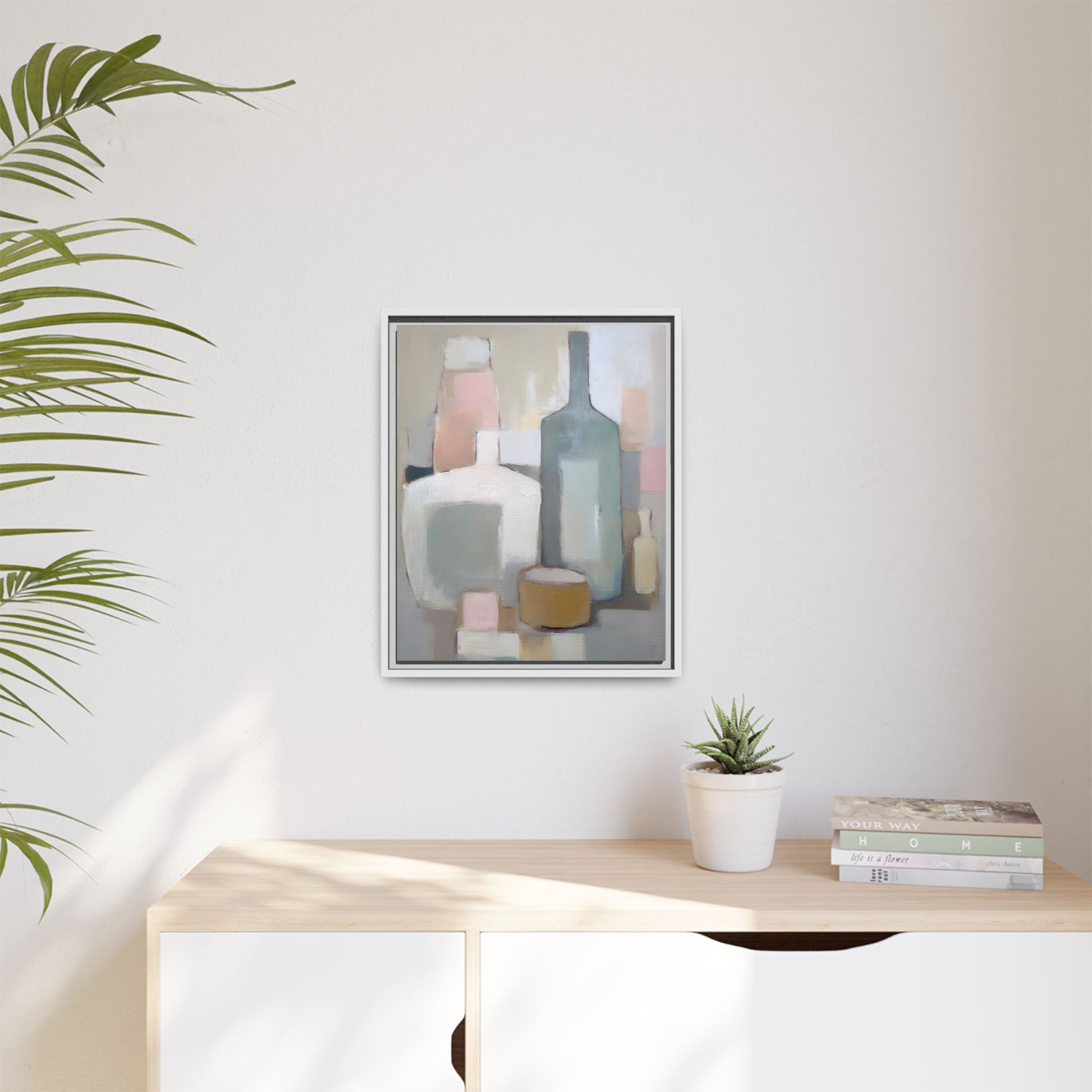 Modern Abstract Bottle Still Life Wall Art – Framed Canvas in Soft Pink, Blue, and Beige hanging in a minimalist interior