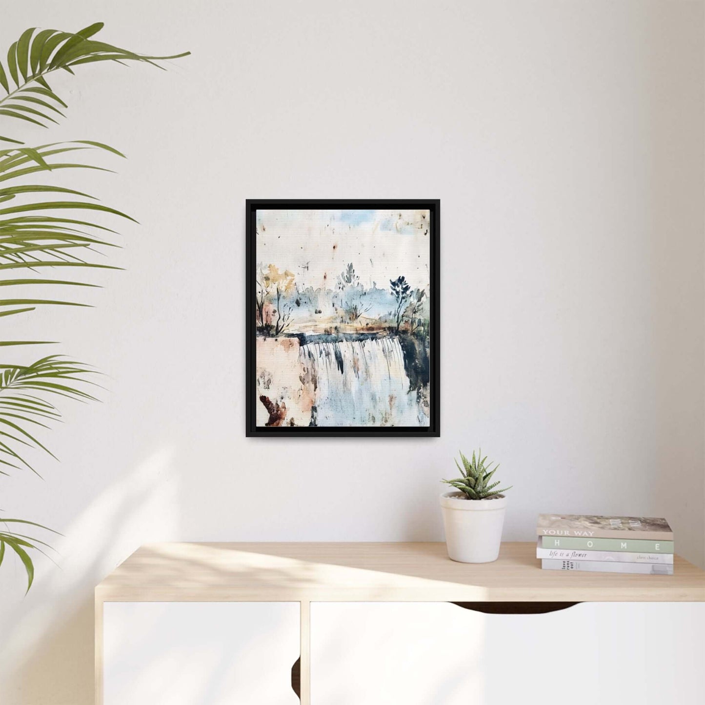 Framed Watercolor Wall Art depicting a serene landscape, styled in a modern interior with plants and books for decor inspiration.