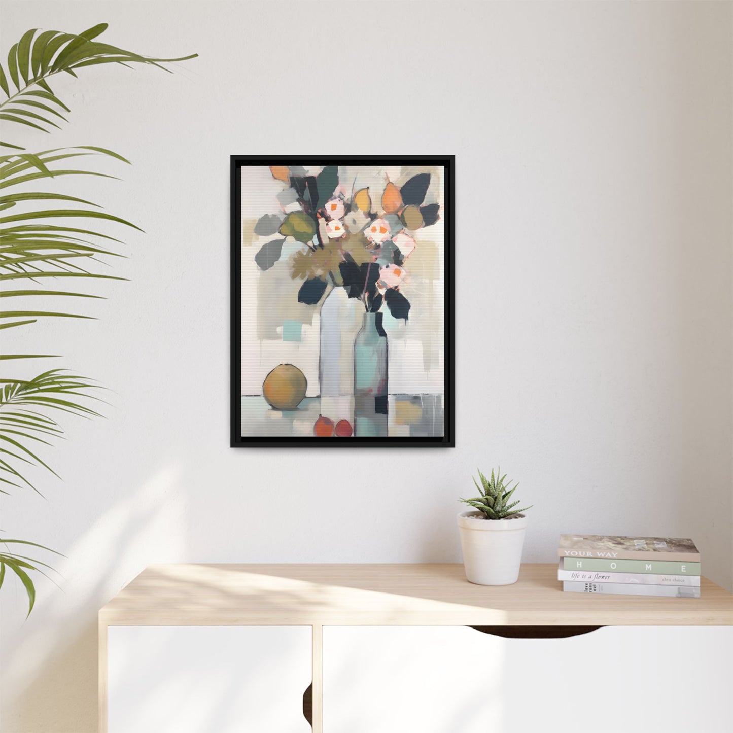 Modern Floral Still Life Wall Art – Framed Canvas with Bold Leaves and Citrus in Vase in a minimalist interior