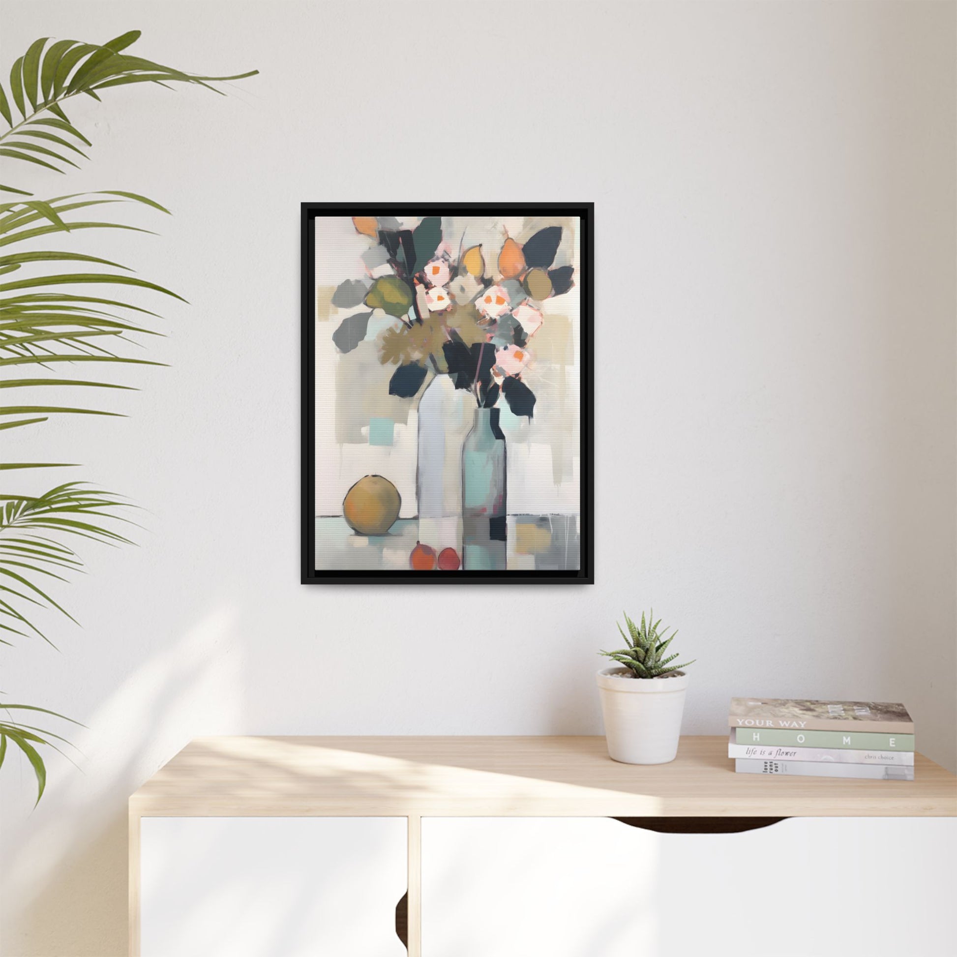 Modern Floral Still Life Wall Art – Framed Canvas with Bold Leaves and Citrus in Vase in a minimalist interior