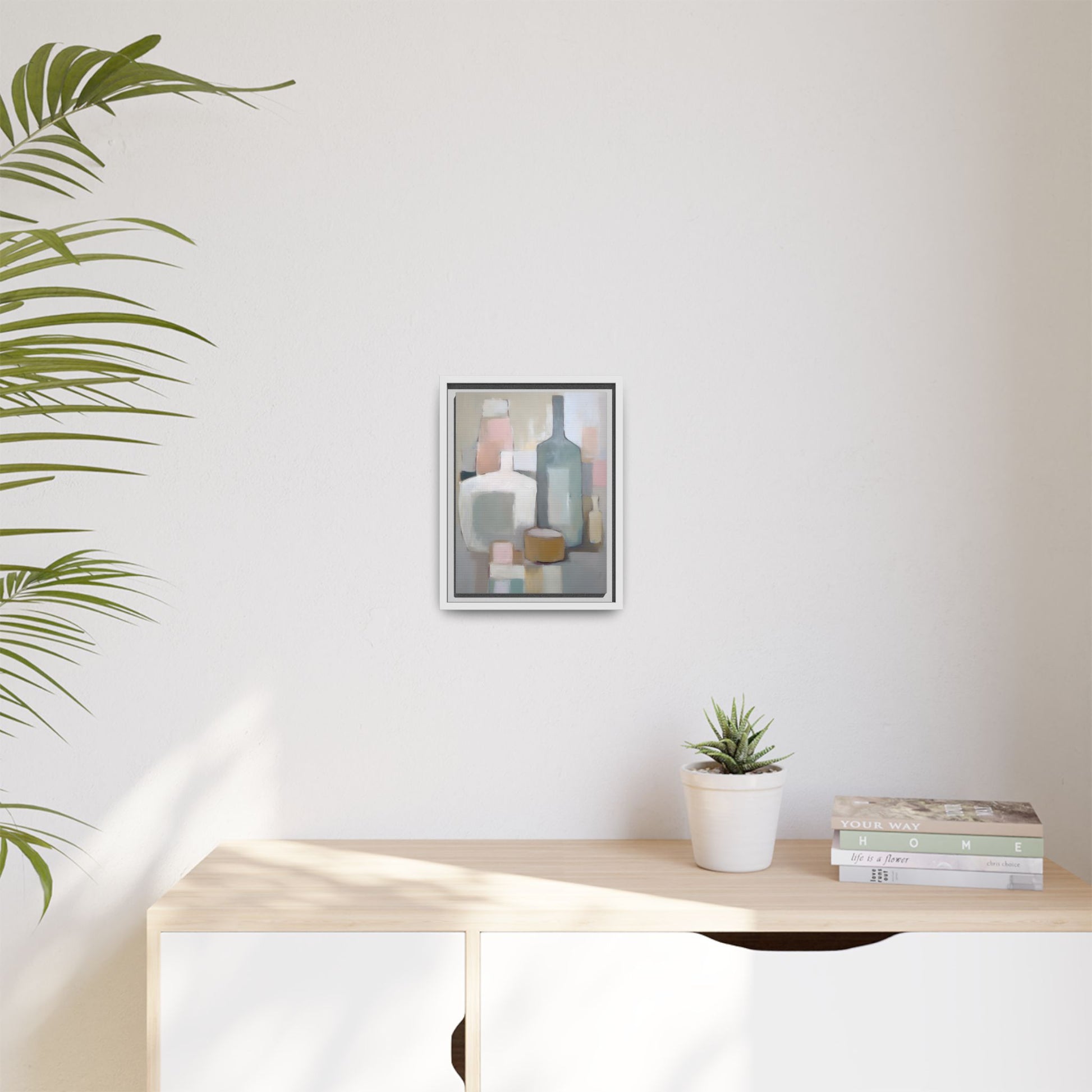 Modern Abstract Bottle Still Life Wall Art – Framed Canvas in Soft Pink, Blue, and Beige displayed in a minimal room.
