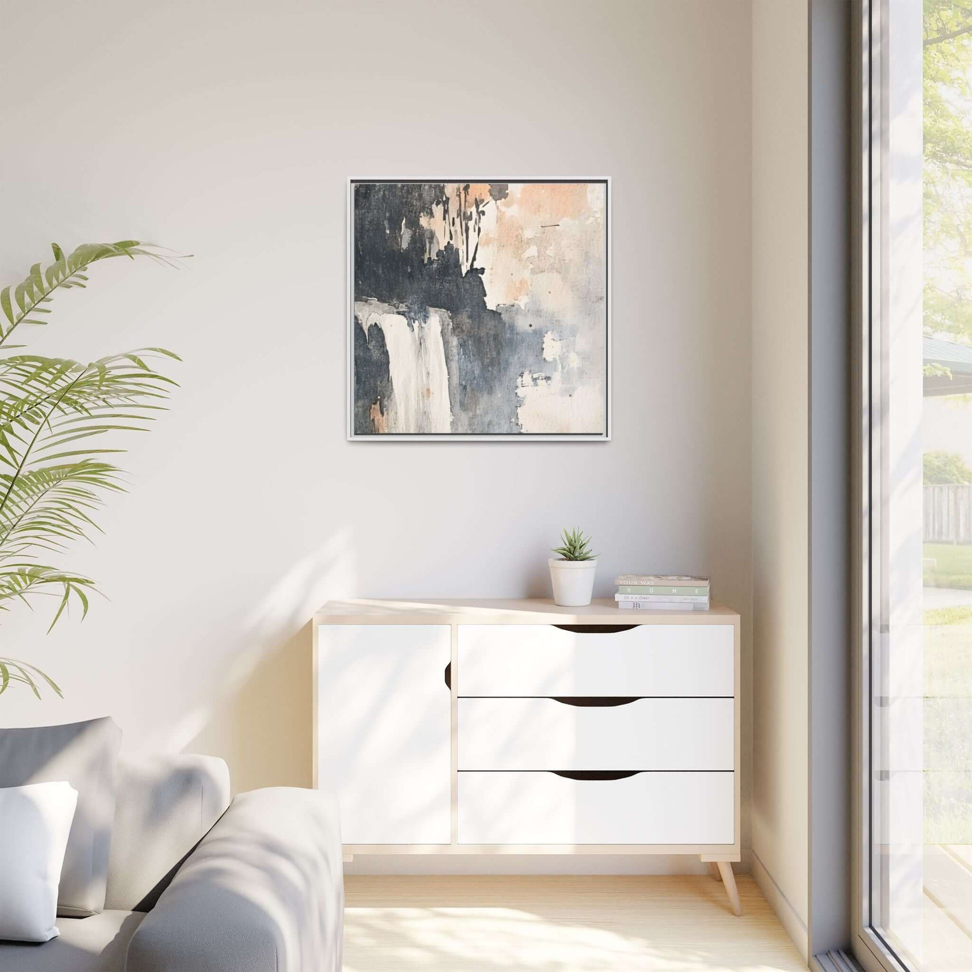 Framed waterfall art print on matte canvas displayed in minimalist living room, complementing modern home decor, 24" x 24" square size.