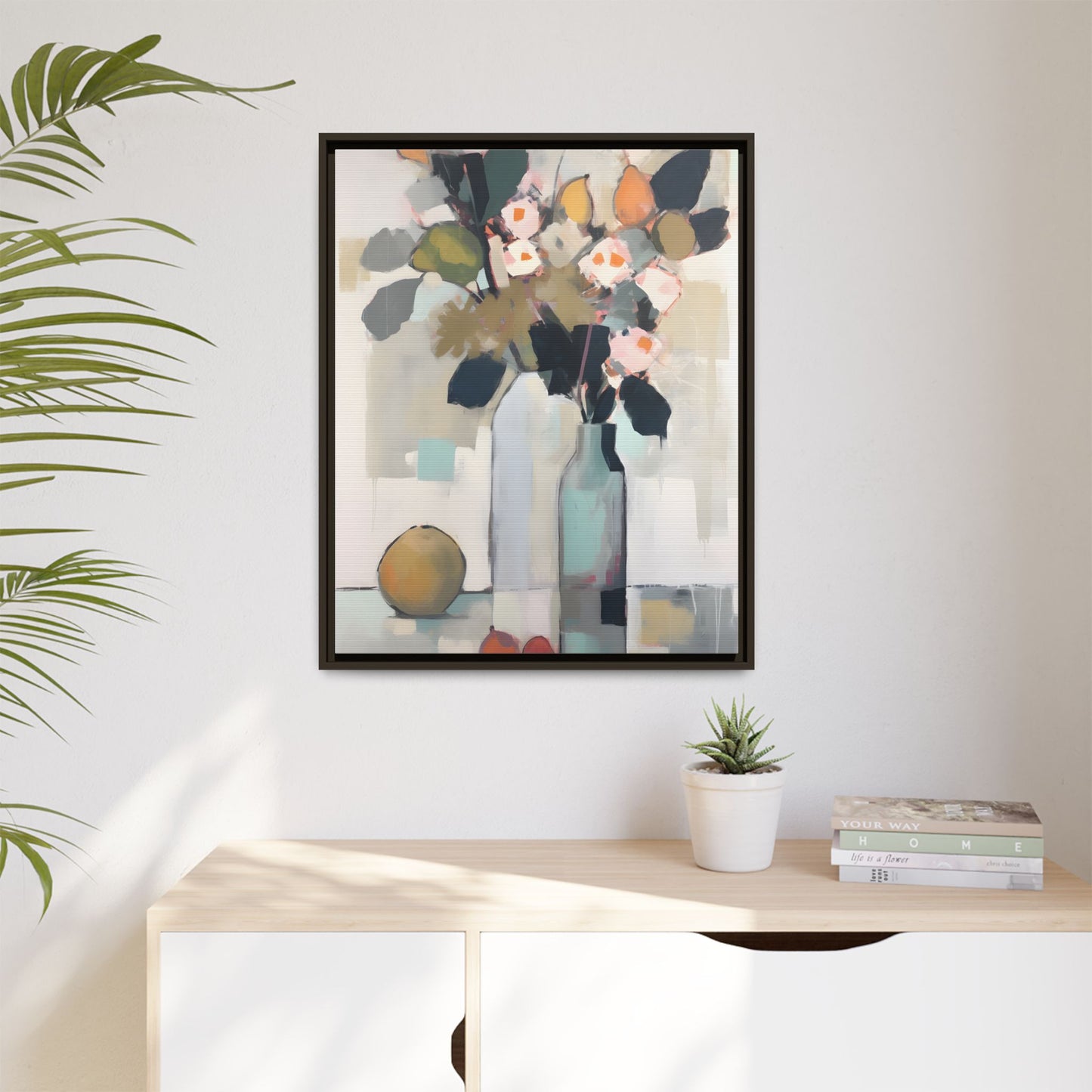 Modern Floral Still Life Wall Art – Framed Canvas with Bold Leaves and Citrus in Vase in living room setting