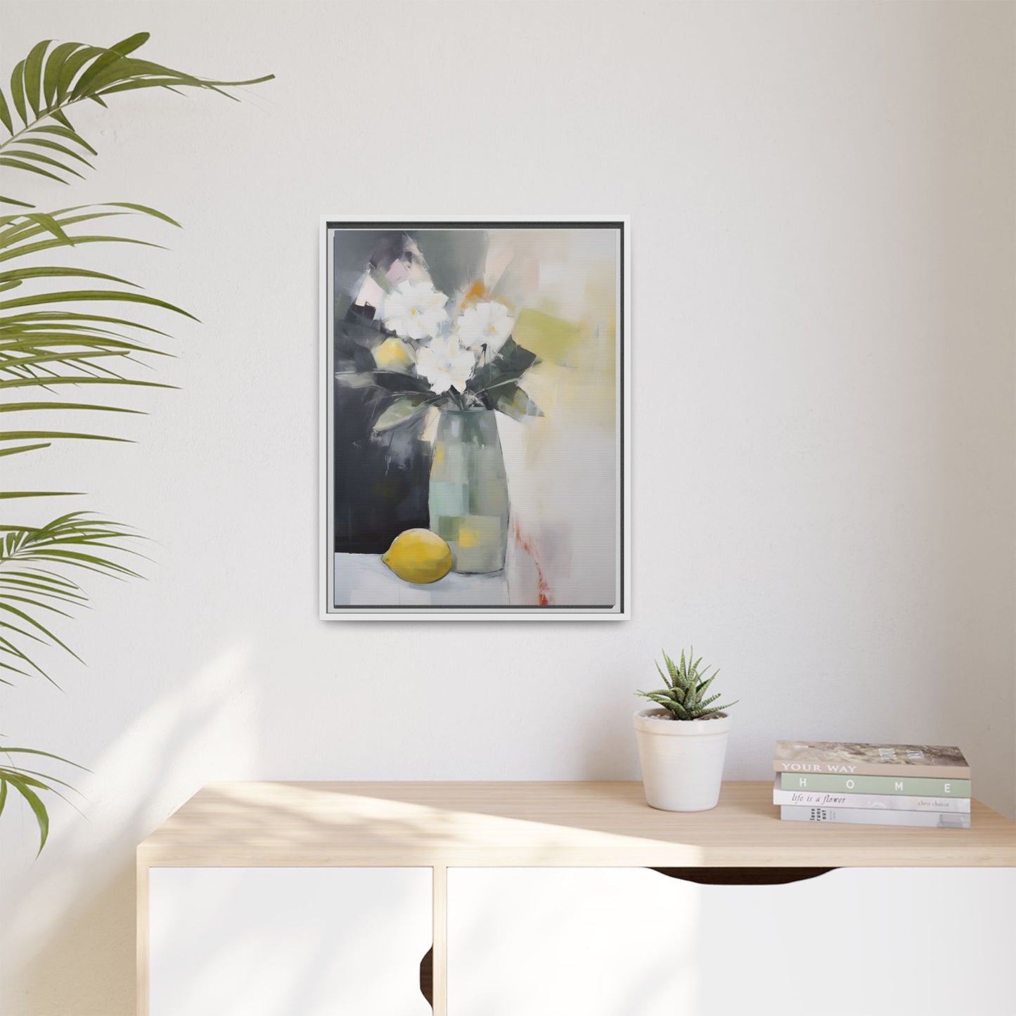 Modern Floral Still Life Wall Art – Framed Canvas with White Flowers and Lemon in Soft Green Vase displayed on wall in bright room