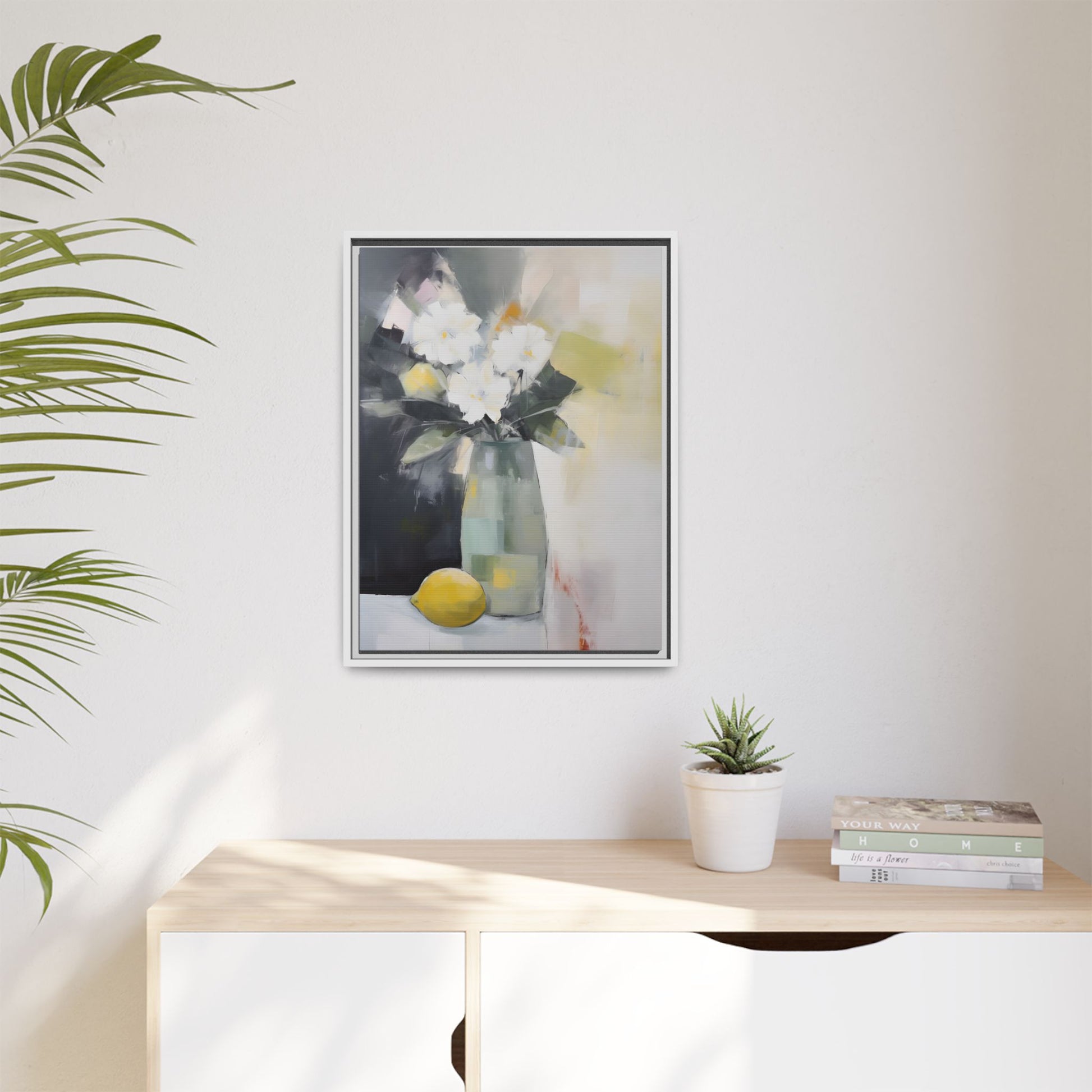 Modern Floral Still Life Wall Art – Framed Canvas with White Flowers and Lemon in Soft Green Vase displayed on wall in bright room