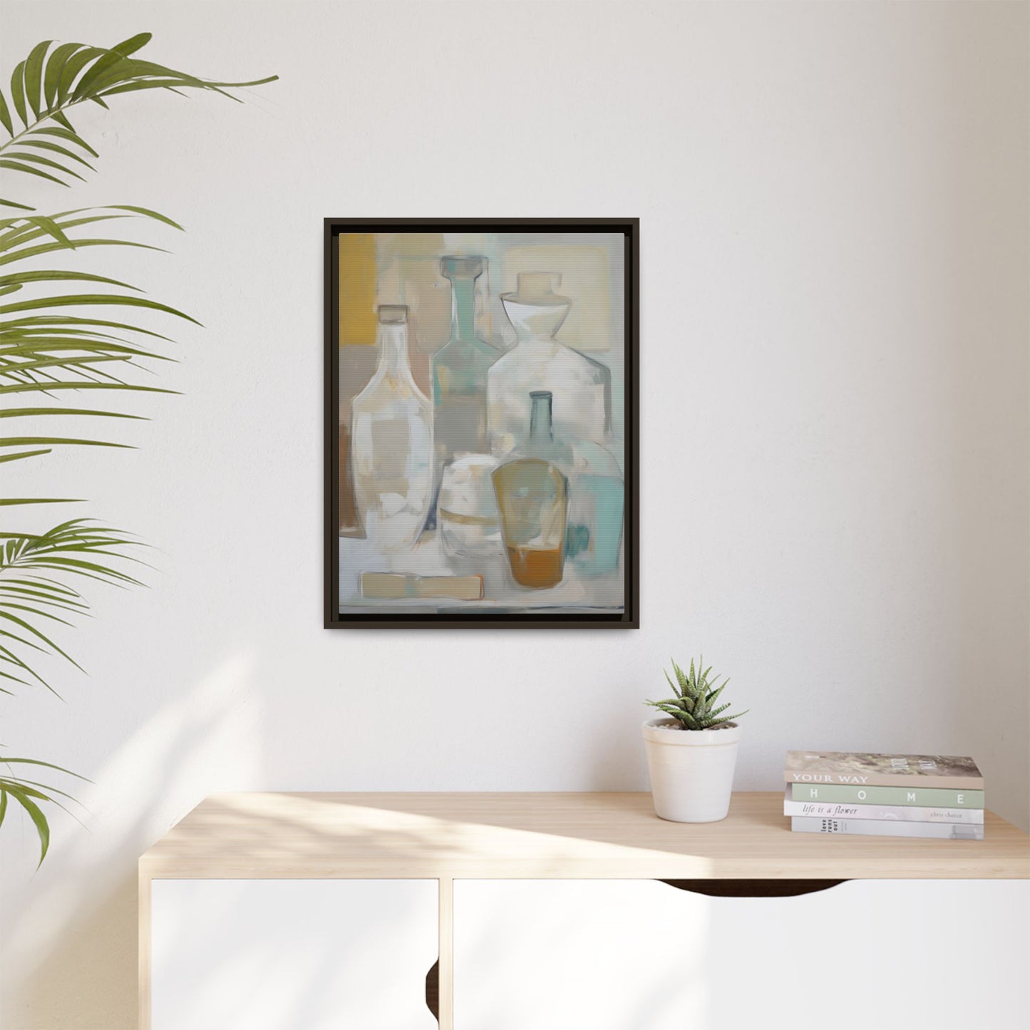 Modern Still Life Wall Art – Neutral Bottles Framed Canvas in Beige, Aqua & Amber displayed in a minimal interior setting.