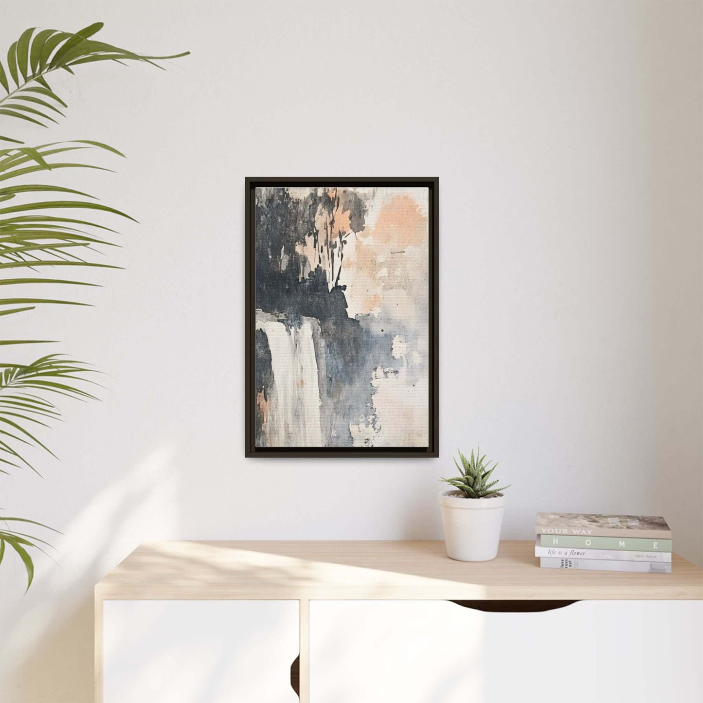 Framed abstract waterfall art print on matte canvas displayed on wall with neutral decor.