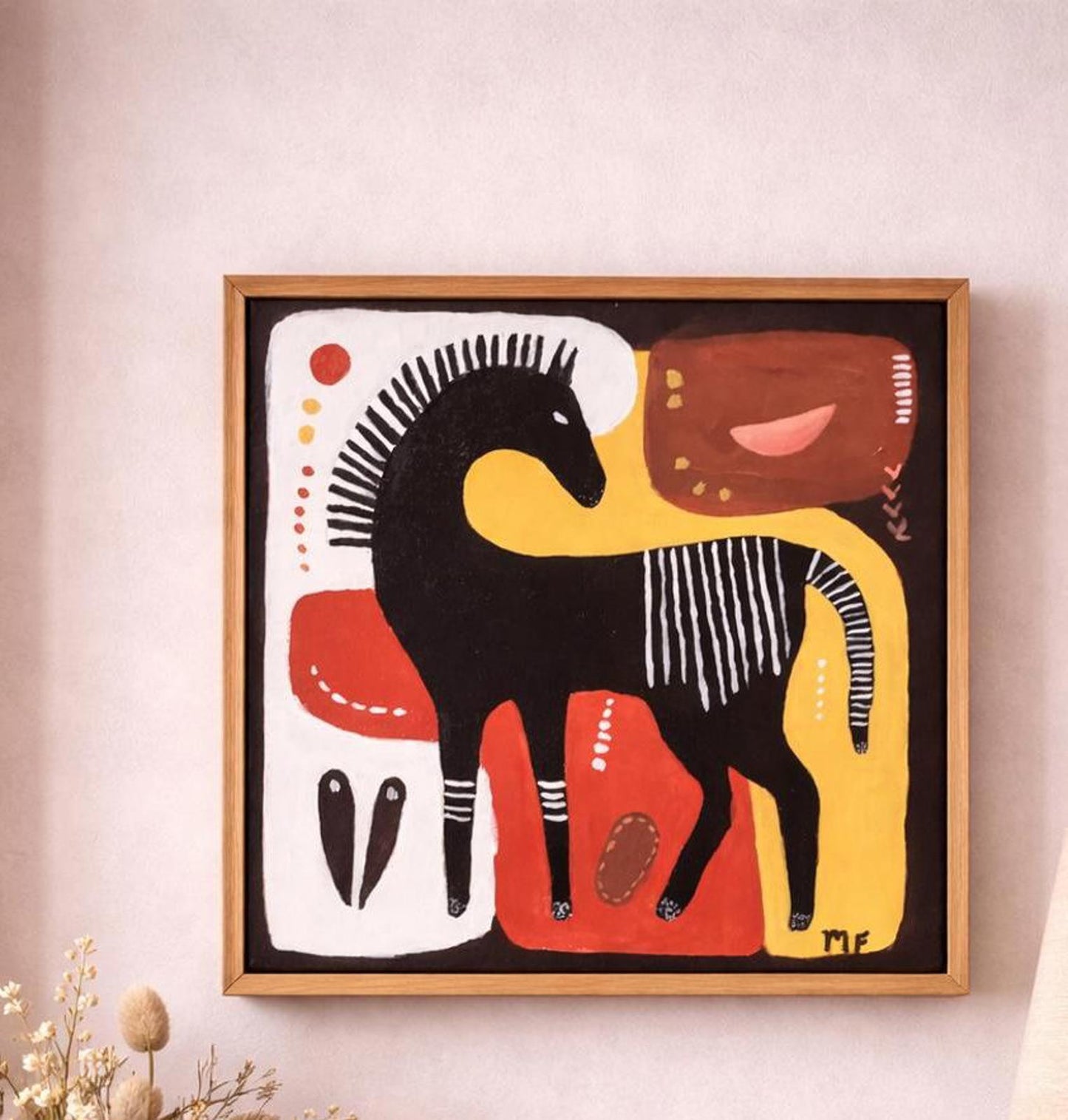 Framed abstract artwork of a horse on a light pink wall.