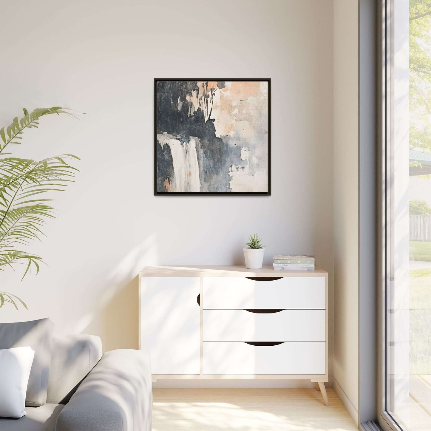 Framed abstract waterfall art print on wall, home decor, matte canvas in modern living room with light furniture and natural lighting.